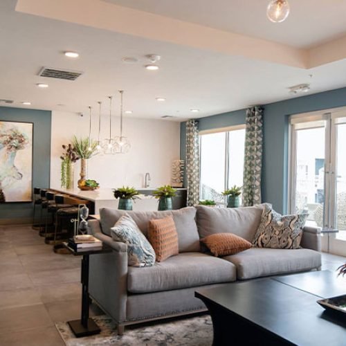 black-wooden-coffee-table-near-white-couch